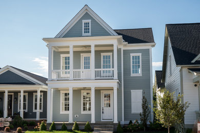 Mid-sized transitional blue three-story vinyl gable roof photo in Louisville
