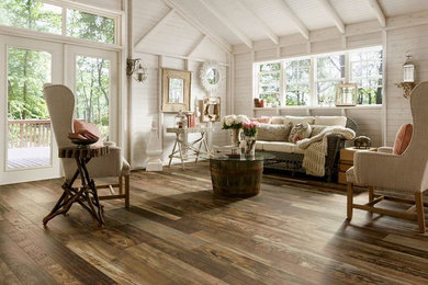 Inspiration for a mid-sized shabby-chic style formal and open concept dark wood floor and brown floor living room remodel in San Diego with white walls and no tv