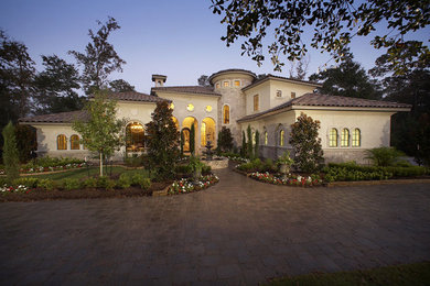 Example of a tuscan exterior home design in Houston