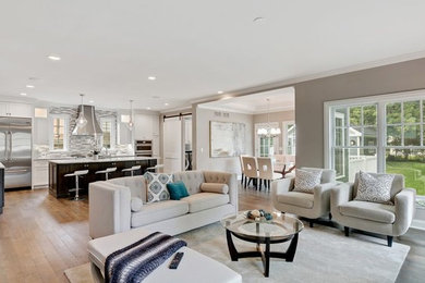 Living room - mid-sized transitional formal and open concept medium tone wood floor and brown floor living room idea in Chicago with beige walls, no fireplace and no tv