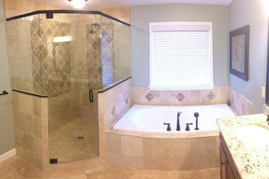 Large master bathroom photo in Atlanta with a drop-in sink, recessed-panel cabinets, medium tone wood cabinets, granite countertops and gray walls