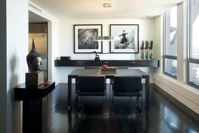 Inspiration for a mid-sized contemporary black floor and dark wood floor enclosed dining room remodel in Boston with white walls and no fireplace
