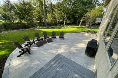 Large backyard concrete patio photo in Columbus