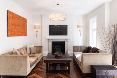 Design ideas for a large contemporary enclosed living room in Hertfordshire with grey walls, dark hardwood flooring, a standard fireplace, a stone fireplace surround, a wall mounted tv and brown floors.