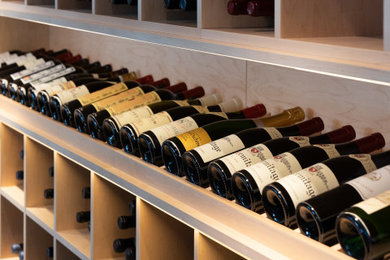 This is an example of a contemporary wine cellar in Montreal.