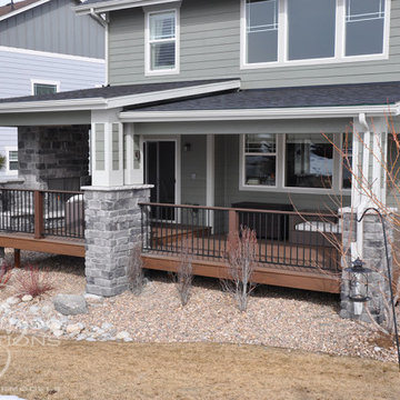 Castle Rock Covered Deck with Fireplace and Iron Railing