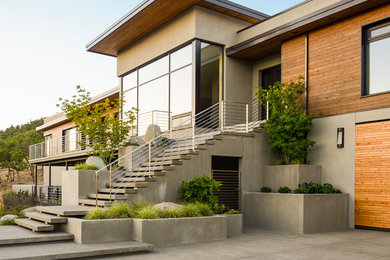 This is an example of a large modern two-storey beige exterior in Portland.