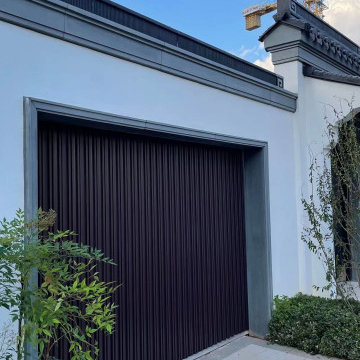 Side sliding automatic garage door for garages with no ceiling space.