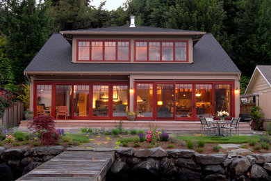 Example of a mid-sized beach style brown two-story exterior home design in Seattle
