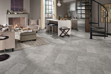 Large trendy open concept vinyl floor living room photo in Orange County with a bar, gray walls, no tv, a standard fireplace and a concrete fireplace