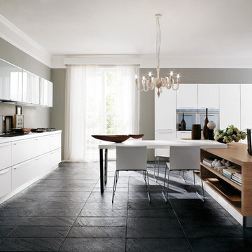 Modern white kitchen with medium wood double sided island
