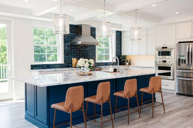 Open concept kitchen - huge transitional l-shaped vinyl floor, gray floor and coffered ceiling open concept kitchen idea in Baltimore with an undermount sink, shaker cabinets, blue cabinets, quartzite countertops, blue backsplash, porcelain backsplash, stainless steel appliances, an island and gray countertops