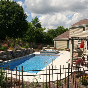 Raised wall and landscaping for privacy screening