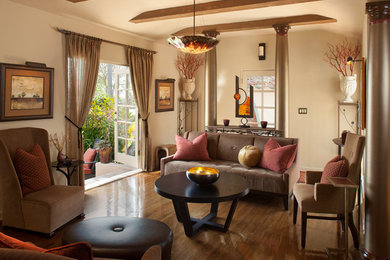 This is an example of a mid-sized contemporary open concept living room in San Diego with beige walls, dark hardwood floors, no fireplace and brown floor.