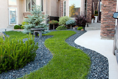 Photo of a contemporary front yard landscaping in Other for summer.