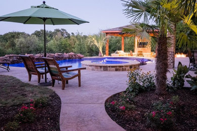 Example of a beach style pool design in Dallas