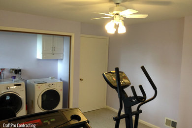 This is an example of a large classic galley utility room in Newark with an utility sink, beaded cabinets, white cabinets, purple walls, carpet and a side by side washer and dryer.