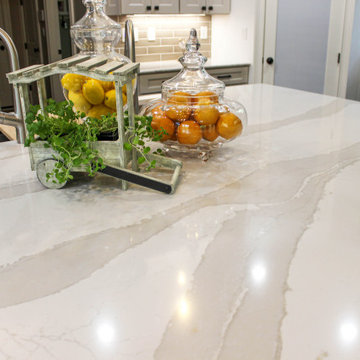 White Kitchen with Espresso Island, Galley Sink, Cambria Britannica Countertop