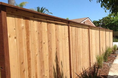 Photo of a small privacy and full sun side yard wood fence landscaping in San Diego for summer.