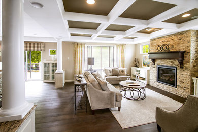 Family room - mid-sized transitional open concept dark wood floor and brown floor family room idea in Milwaukee with beige walls, a standard fireplace, a stone fireplace and no tv