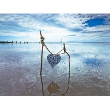 Heart tied up on wooden sticks at the beach Print