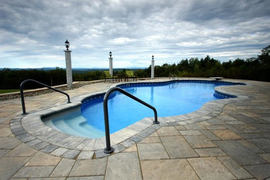 Inspiration for a large backyard custom-shaped pool remodel in Portland Maine