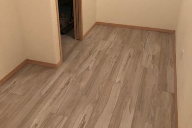Inspiration for a small contemporary gender-neutral vinyl floor and gray floor dressing room remodel in Seattle