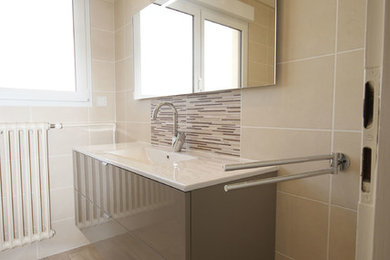 Inspiration for a medium sized contemporary ensuite bathroom in Nancy with beaded cabinets, brown cabinets, a submerged bath, a shower/bath combination, a two-piece toilet, white tiles, brown tiles, beige walls, light hardwood flooring, a wall-mounted sink, beige floors, a hinged door and white worktops.