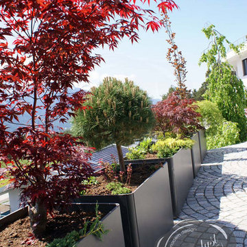 Modern Landscape and Patio Design with Large Modern Garden Planters
