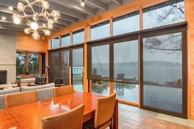 Great room - large contemporary vinyl floor great room idea in Seattle with brown walls