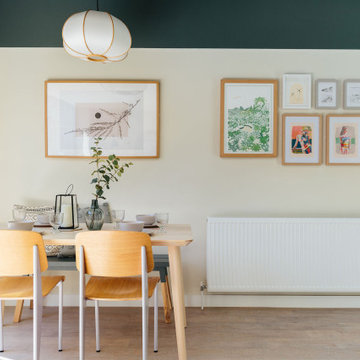 Green and pink kitchen diner near the sea