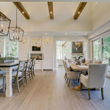 Reclaimed Wood Beams and Mantel in a Vaulted Modern Dining Room