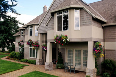 Photo of a two-storey beige exterior in Chicago with mixed siding.
