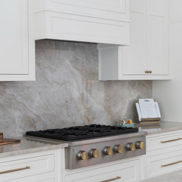 Transitional Kitchen Range Detail with Full-Height Stone Slab Backsplash