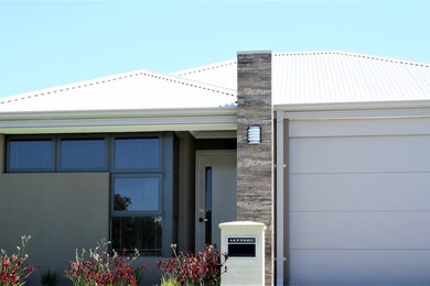 Design ideas for a modern one-storey brown exterior in Perth with a metal roof.