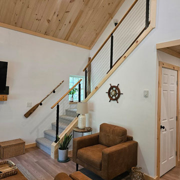 Modern Cable Railing System for a Bright and Open Lake-Style Interior