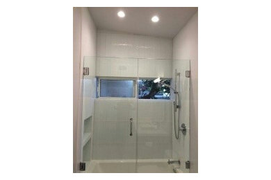 Example of a minimalist white tile and ceramic tile ceramic tile bathroom design in Los Angeles with an undermount sink, flat-panel cabinets, dark wood cabinets, quartz countertops, a one-piece toilet and gray walls