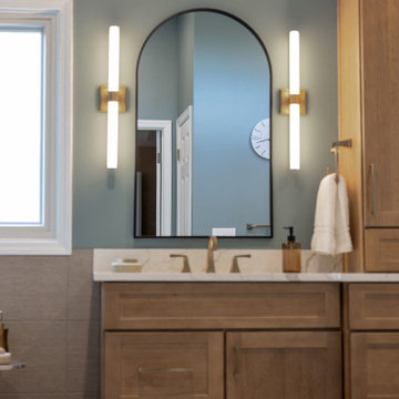 Spa Like Primary Bathroom Remodel with Warm Wood & Brass Details
