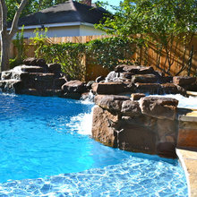 Swimwing pool rock waterfalls