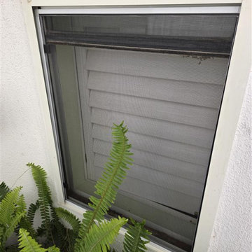 window screens las Vegas installation on side with plant