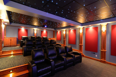 Example of a large minimalist enclosed home theater design in Cleveland with a projector screen