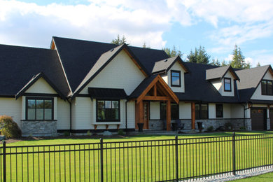 Inspiration for a craftsman two-story wood gable roof remodel in Vancouver with a shingle roof