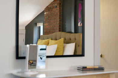 Large trendy master dark wood floor and brown floor bedroom photo in Other with white walls and no fireplace