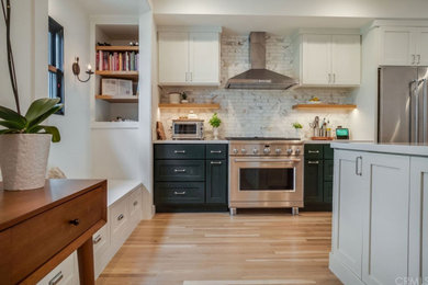 Example of a kitchen design in Santa Barbara with an island