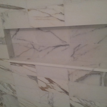 Marble Look Shower Stall with Black and White Mosaic Floor