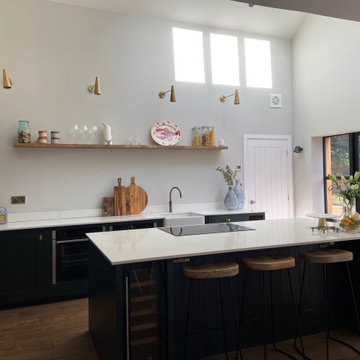Large handmade kitchen with kitchen island and full length larder