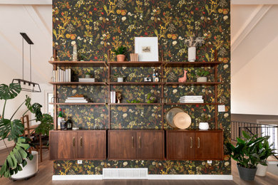 Example of a 1950s wallpaper entryway design in Denver with green walls