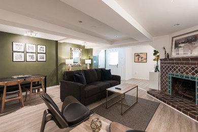 Example of a small mid-century modern walk-out gray floor basement design in DC Metro with a corner fireplace and a tile fireplace