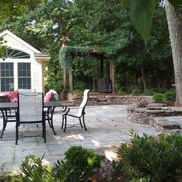 Bluestone Patio/Fieldstone Seating Wall/Integrated Firepit/Plantings