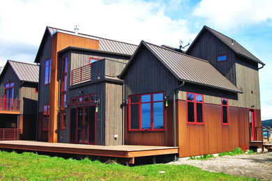 Mid-sized mountain style gray two-story metal exterior home photo in Seattle with a metal roof